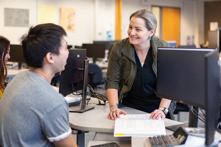 Professor Rhianna helping a student