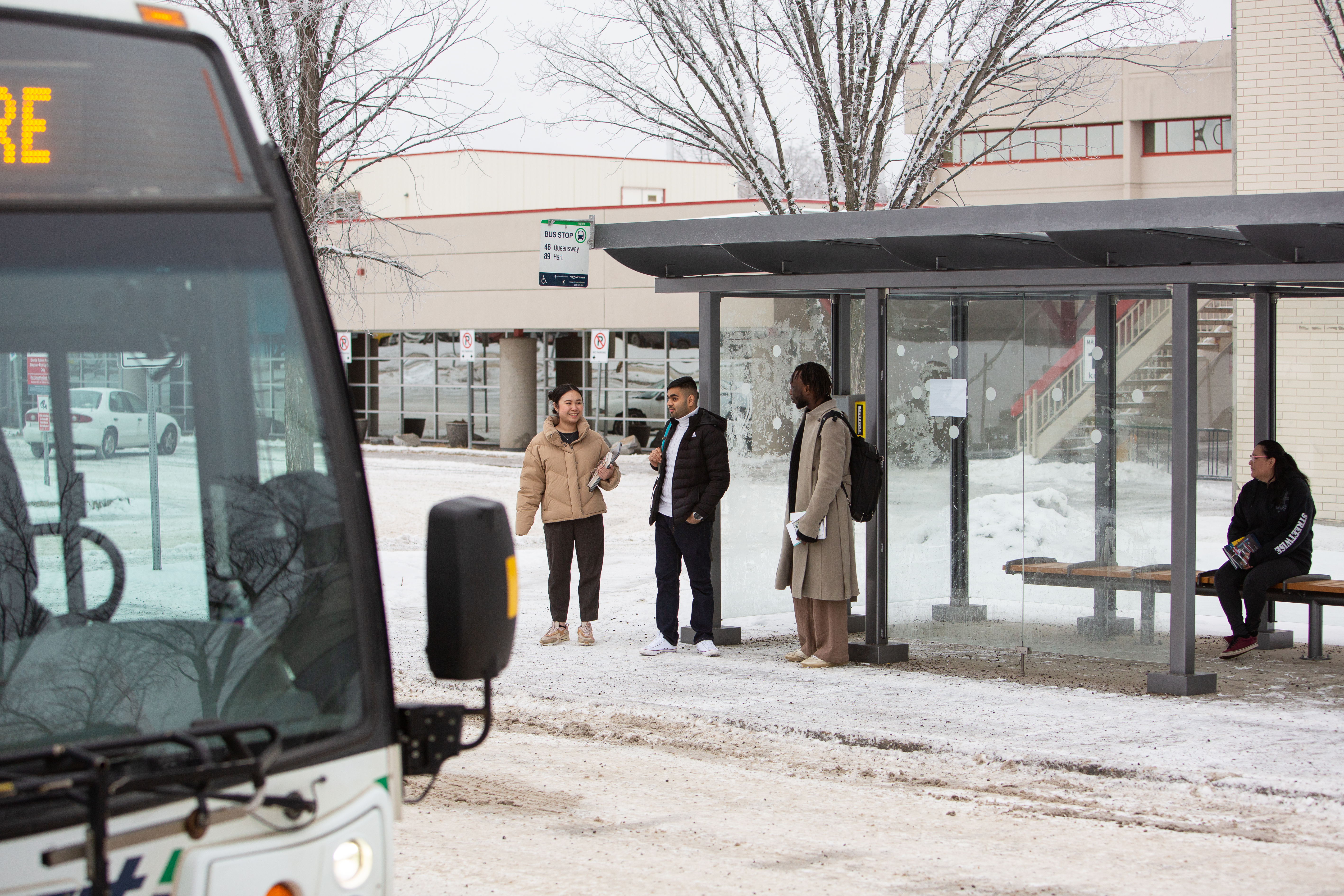 Students at the PG Campus bus stop