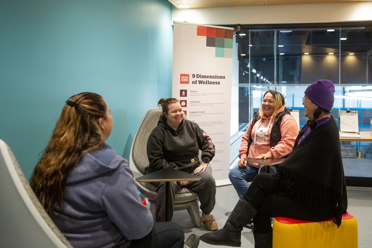Students sitting together laughing