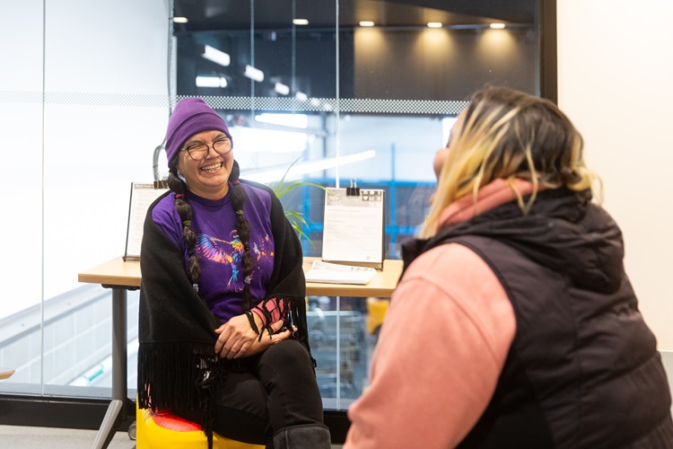 2 students laughing together