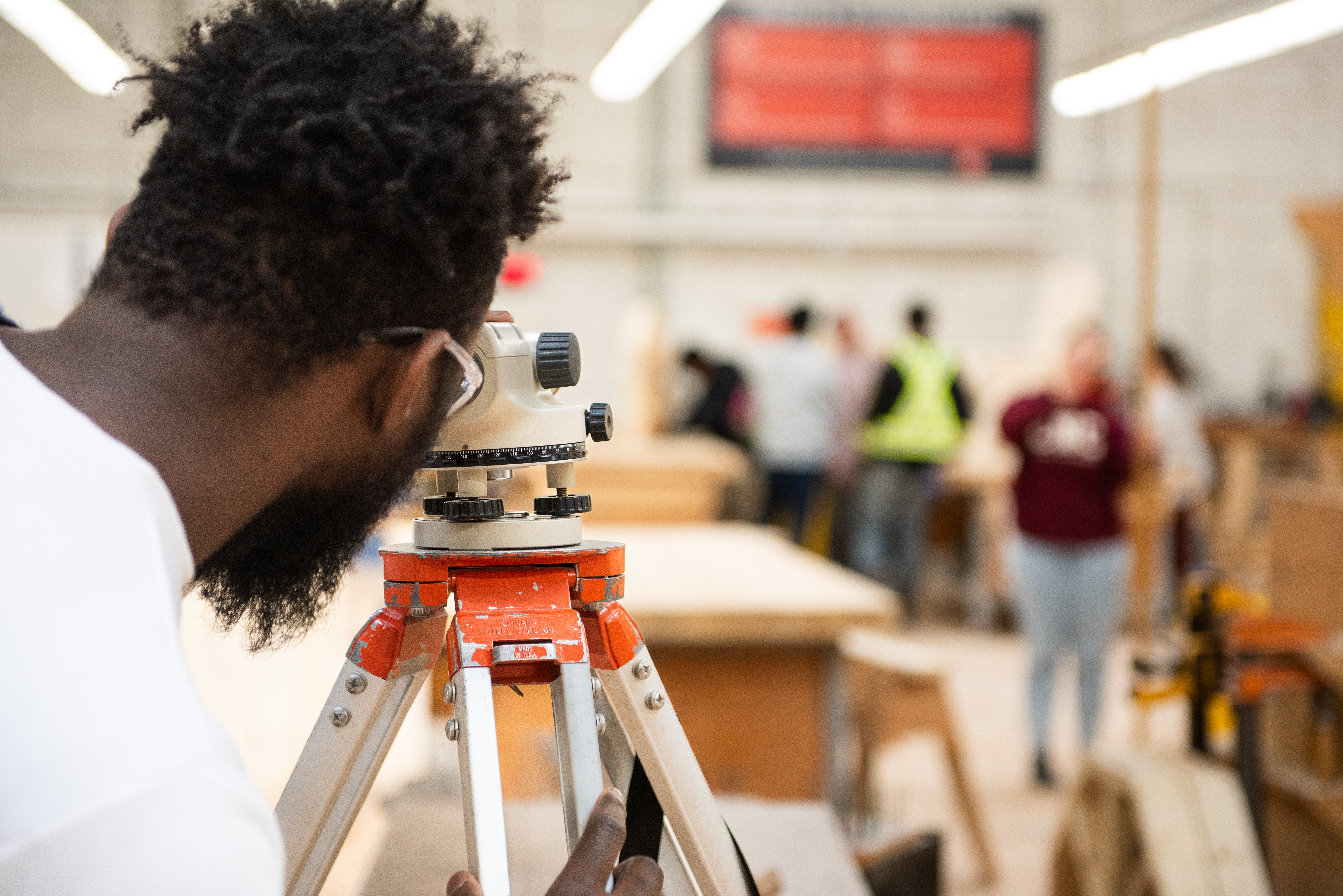Carpenter using leveling tool