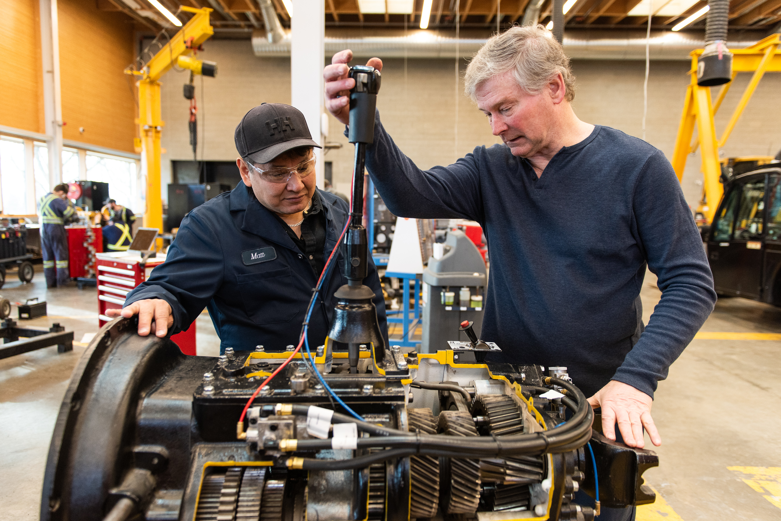 Student and instructor working on a transmission