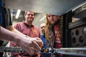 Students examining server rack