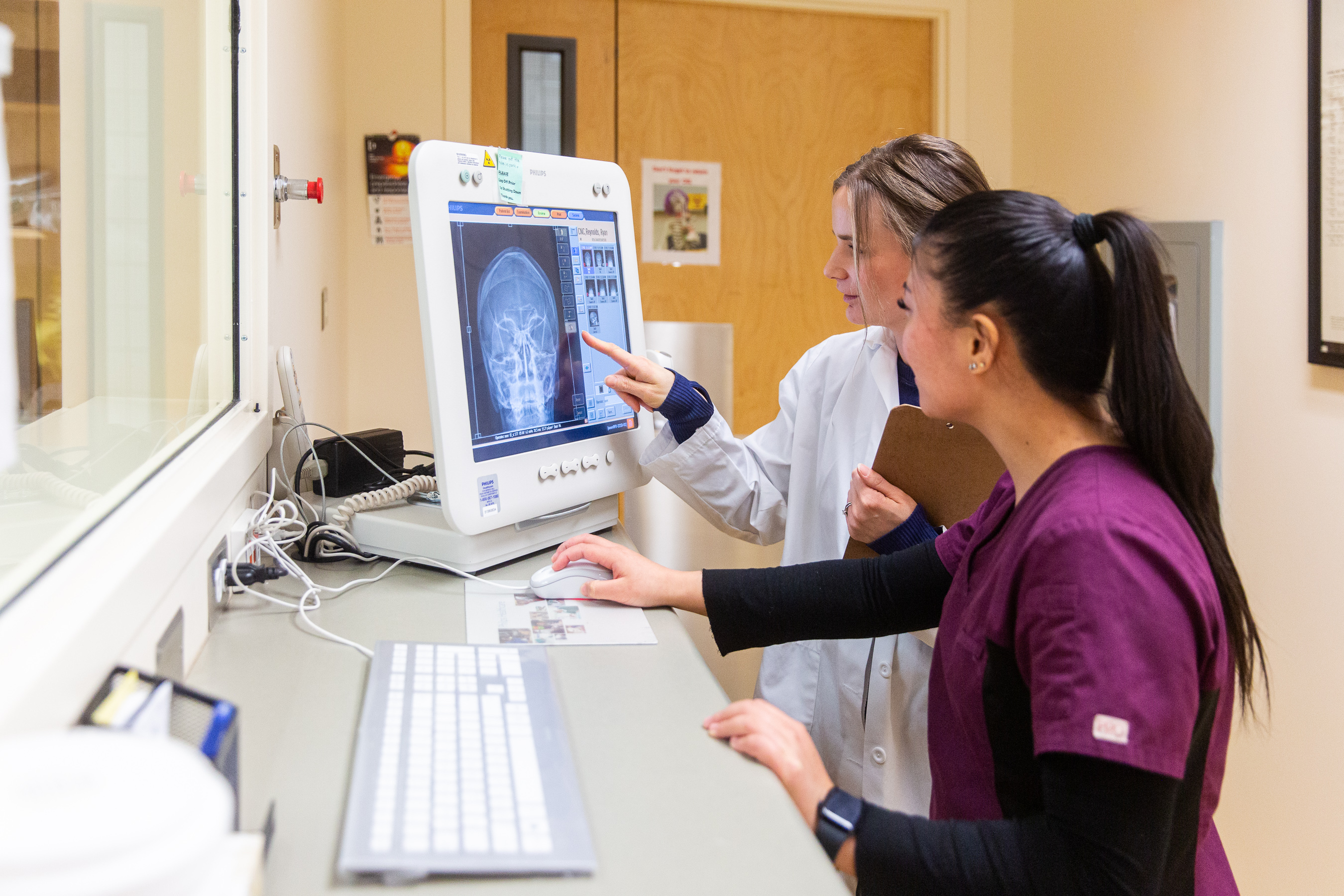 Students examining X-Ray