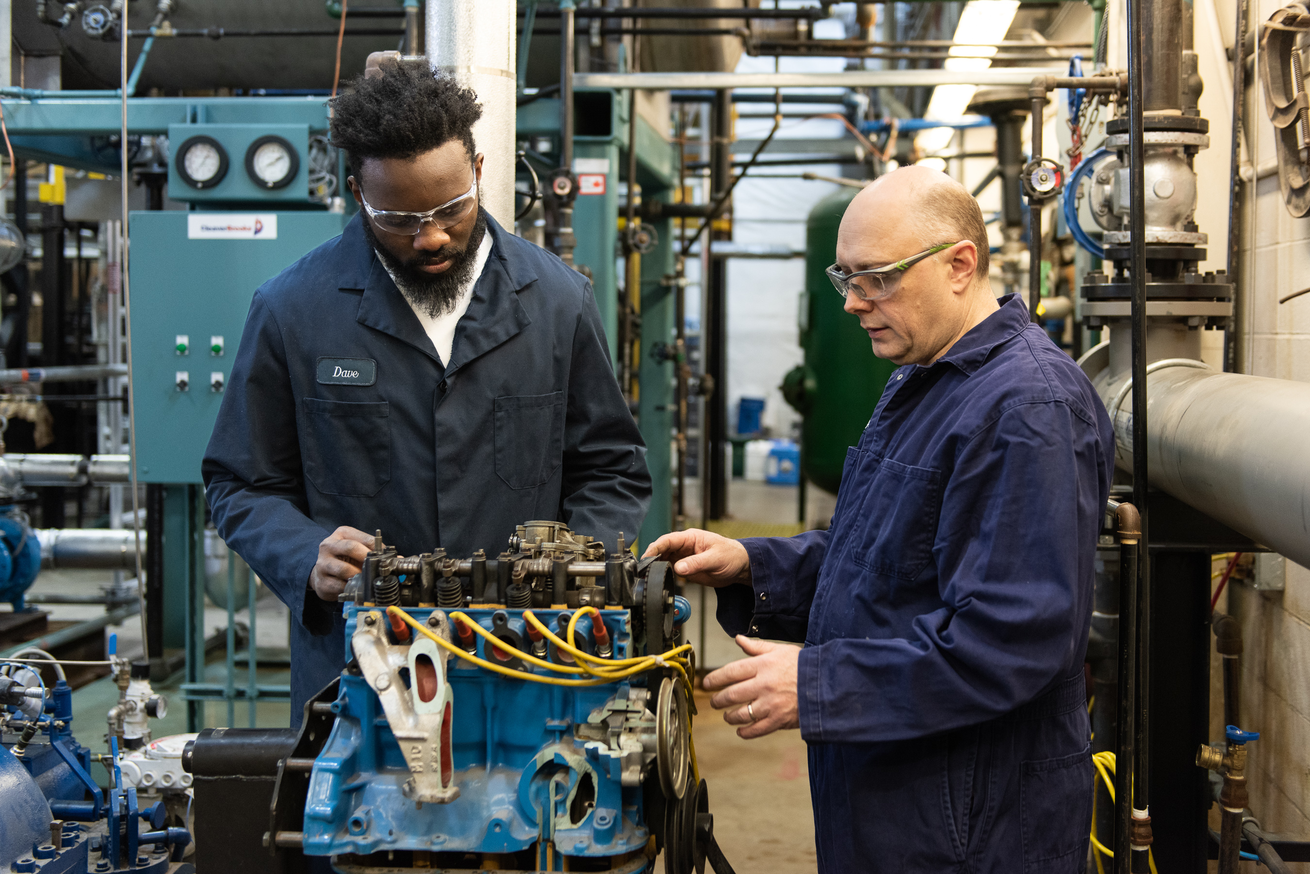 Power engineering student working with professor