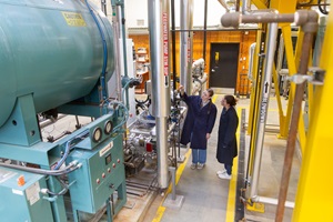 Student examining feedwater pump