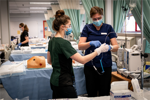 Student preparing an IV