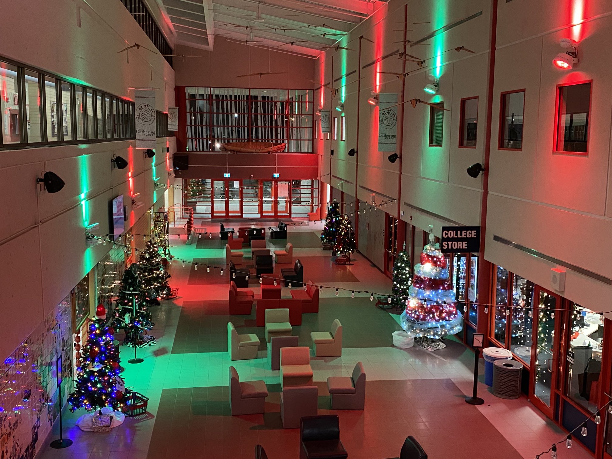 The CNC Prince George atrium lit up with Christmas trees and festive lighting