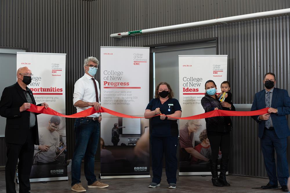 Red tape is cut at the opening of the new CNC Vanderhoof Campus