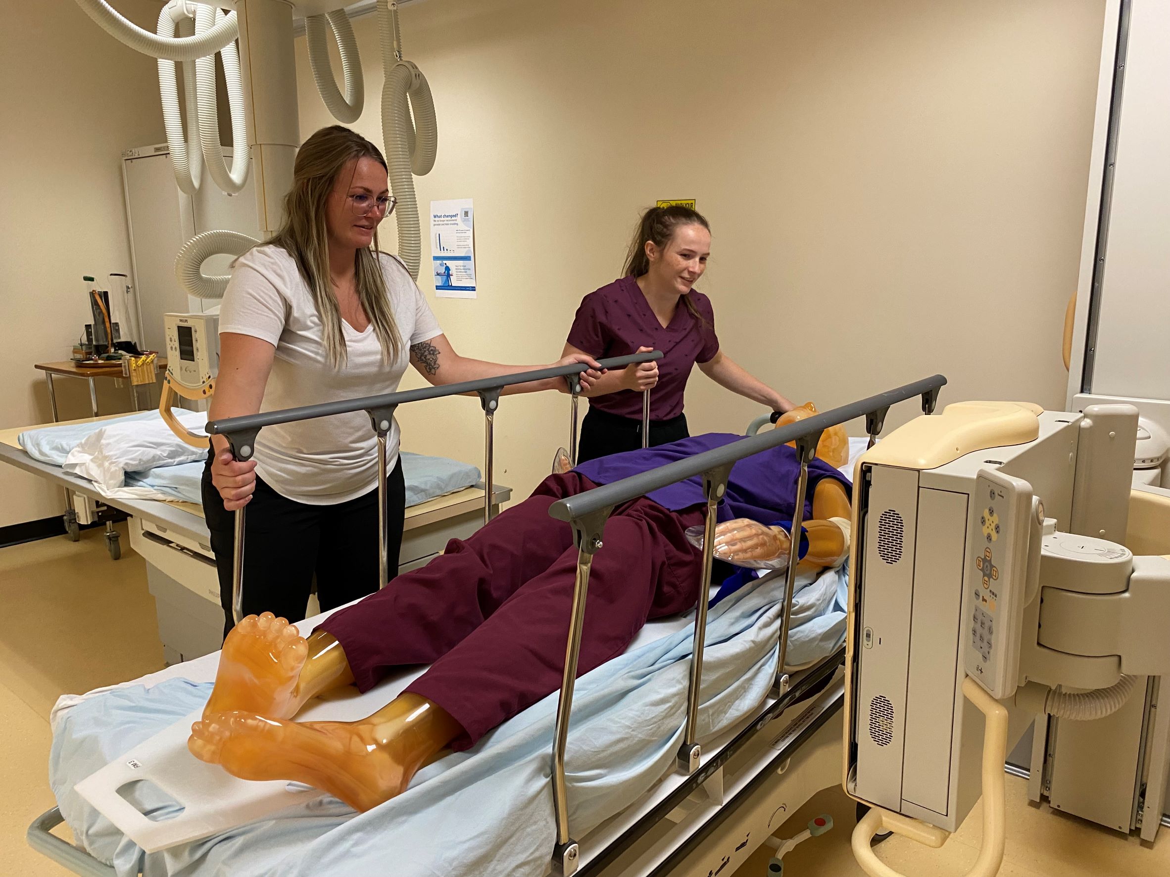 Jayden and Alysha working on a simulation dummy