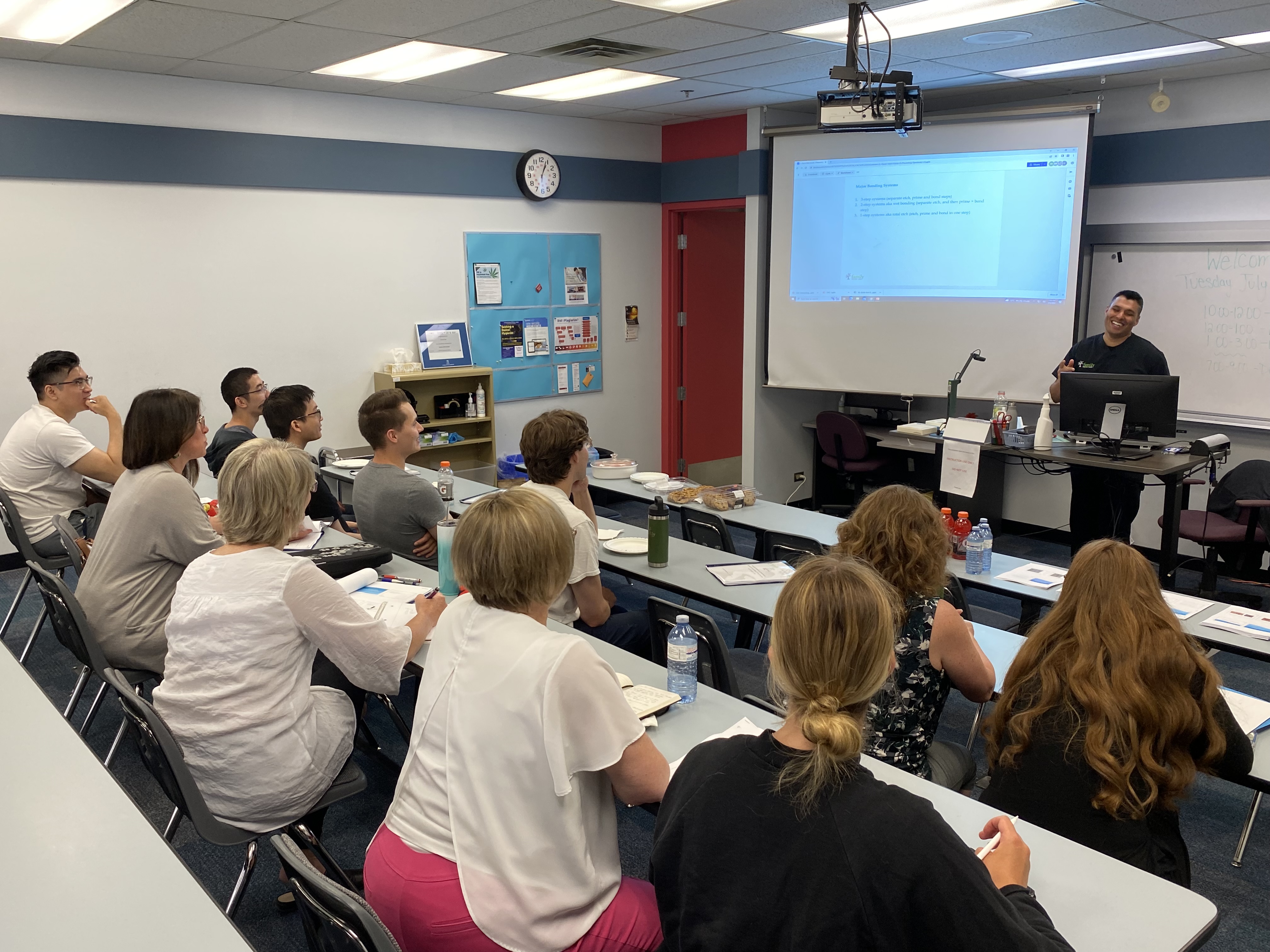 UBC Dentistry watching a lecture with CNC Faculty and Family Dental staff