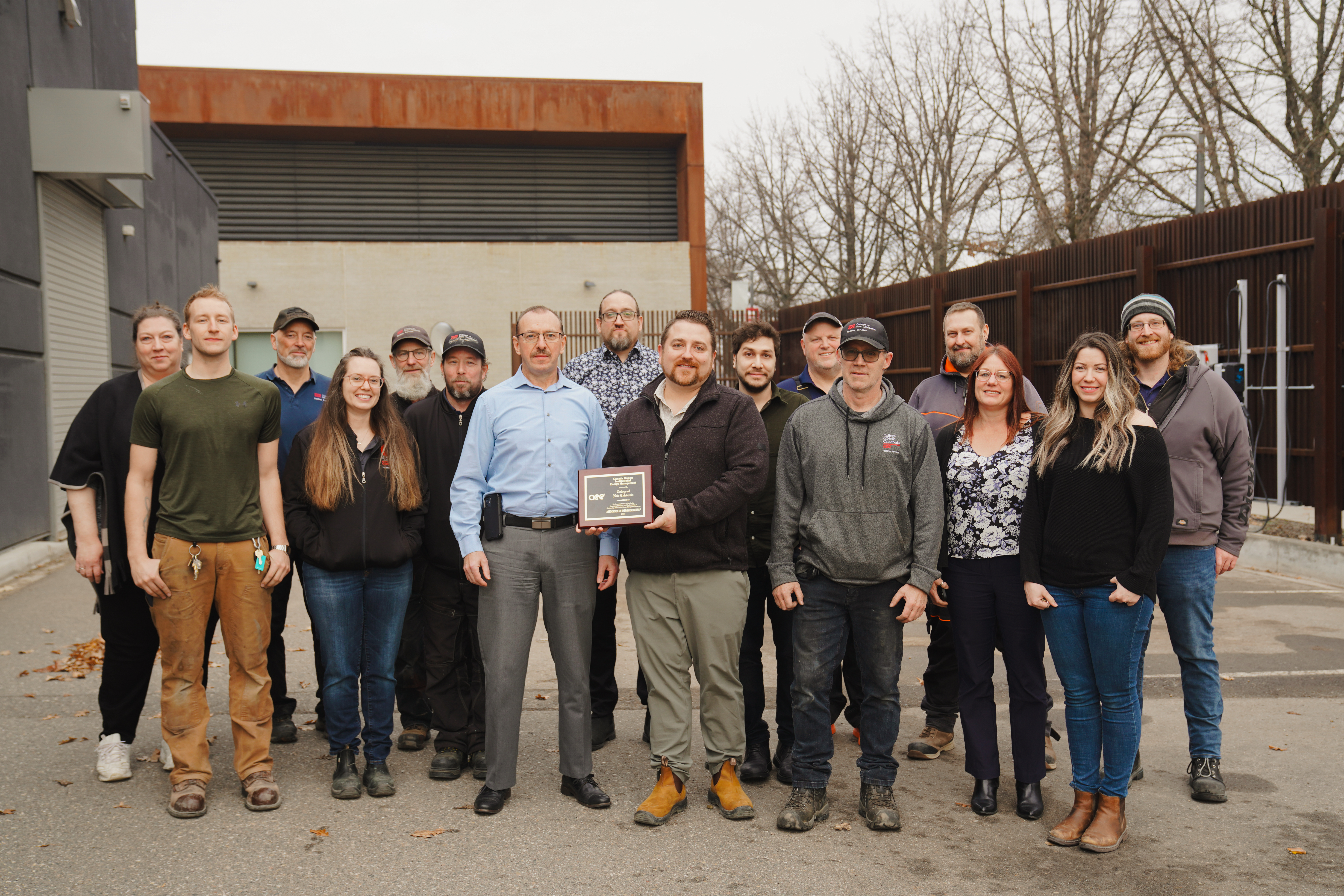 CNC's facilities services team standing with AEE award