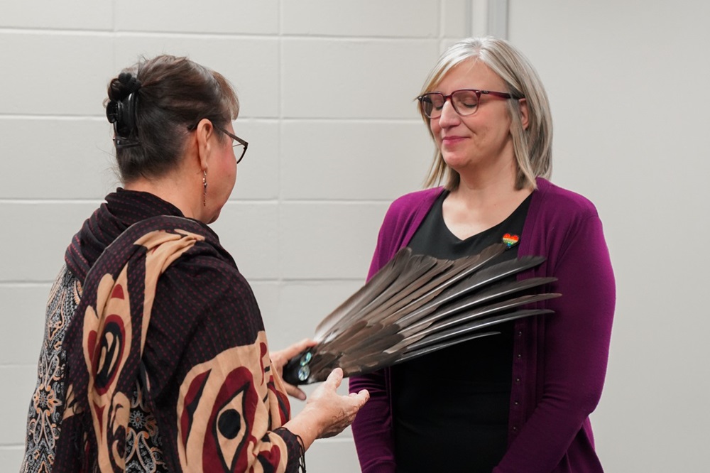 Cindy experiences feather brushing ceremony from Elder Darlene McIntosh