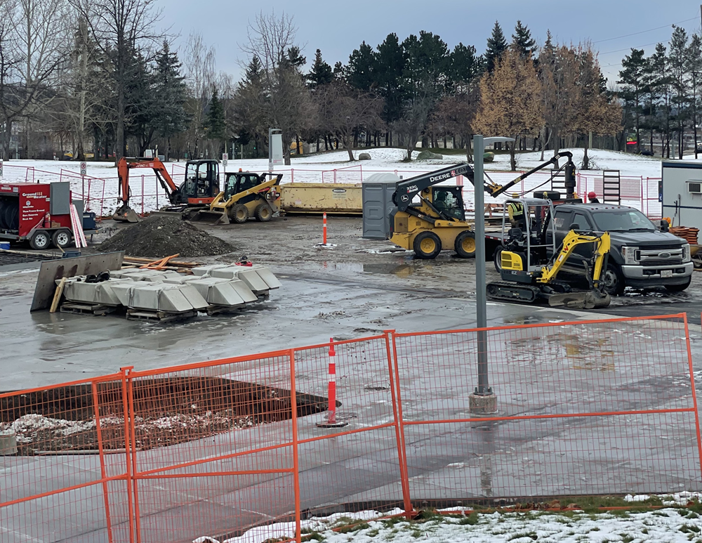 CNC Prince George main entrance construction with fresh concrete poured and Bobcats working