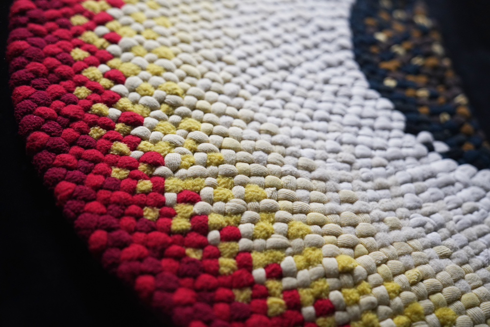 Close-up of colourful woven rug, hand crafted by Elsie Osterberg